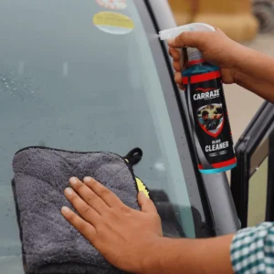 Man spraying Carraze Glass Cleaner on car window for streak-free shine and crystal clear visibility